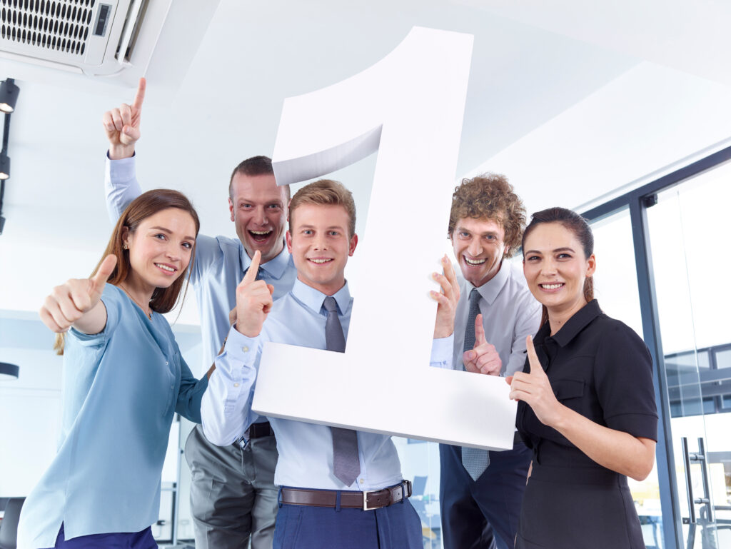 Business people holding large number